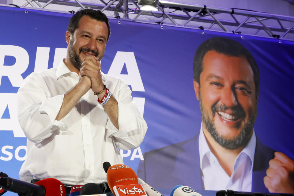 Italian Interior Minister and Deputy Premier Matteo Salvini arrives to meet reporters for a press conference at the League headquarters in Milan, Italy, early Monday morning, May 27, 2019. Italian Interior Minister and Deputy Premier Matteo Salvini, of the League kisses a crucifix as as he talks to reporters during a press conference at the League headquarters in Milan, Italy, early Monday morning, May 27, 2019. Italy's anti-migrant, anti-Islam interior minister, Matteo Salvini, boosted his right-wing League party to become the No. 1 party in Italy, with more than 30 percent of the vote, according to early projections. (AP Photo/Antonio Calanni)