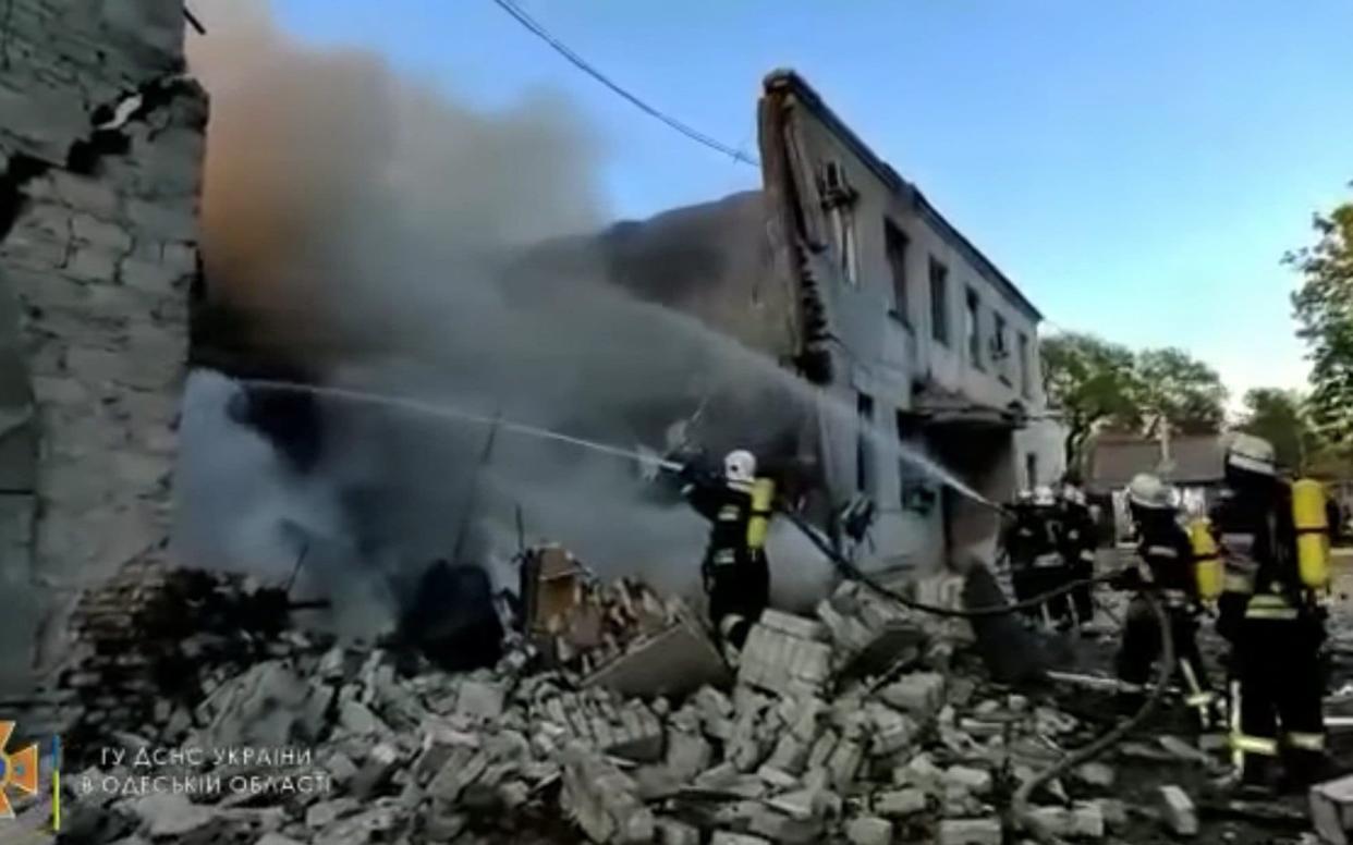 Firefighters spray water onto fire in a destroyed building after a missile strike, in Odesa, Ukraine - State Emergency Service of Ukraine