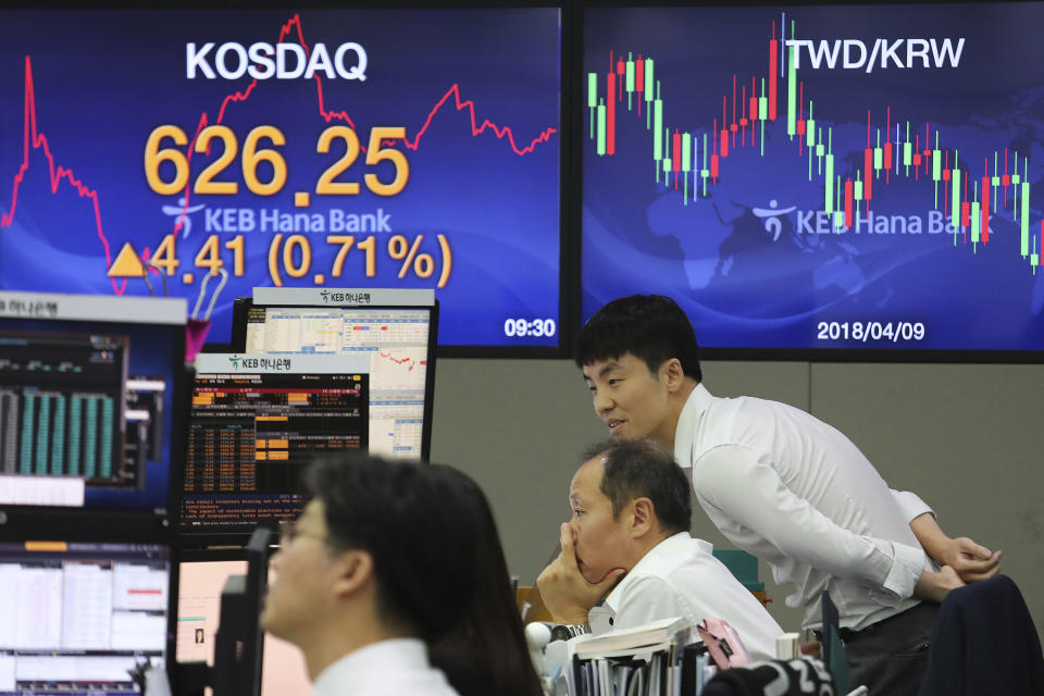 Currency traders watch monitors at the foreign exchange dealing room of the KEB Hana Bank headquarters in Seoul, South Korea, Monday, Oct. 7, 2019. Asian shares were mixed Monday, following a healthy report on U.S. jobs, while investors cautiously awaited the upcoming trade talks between the U.S. and China. (AP Photo/Ahn Young-joon)