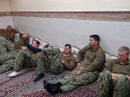 An undated picture released by Iran's Revolutionary Guards website shows American sailors sitting in an unknown place in Iran. REUTERS/sepahnews.ir/TIMA/Handout via Reuters