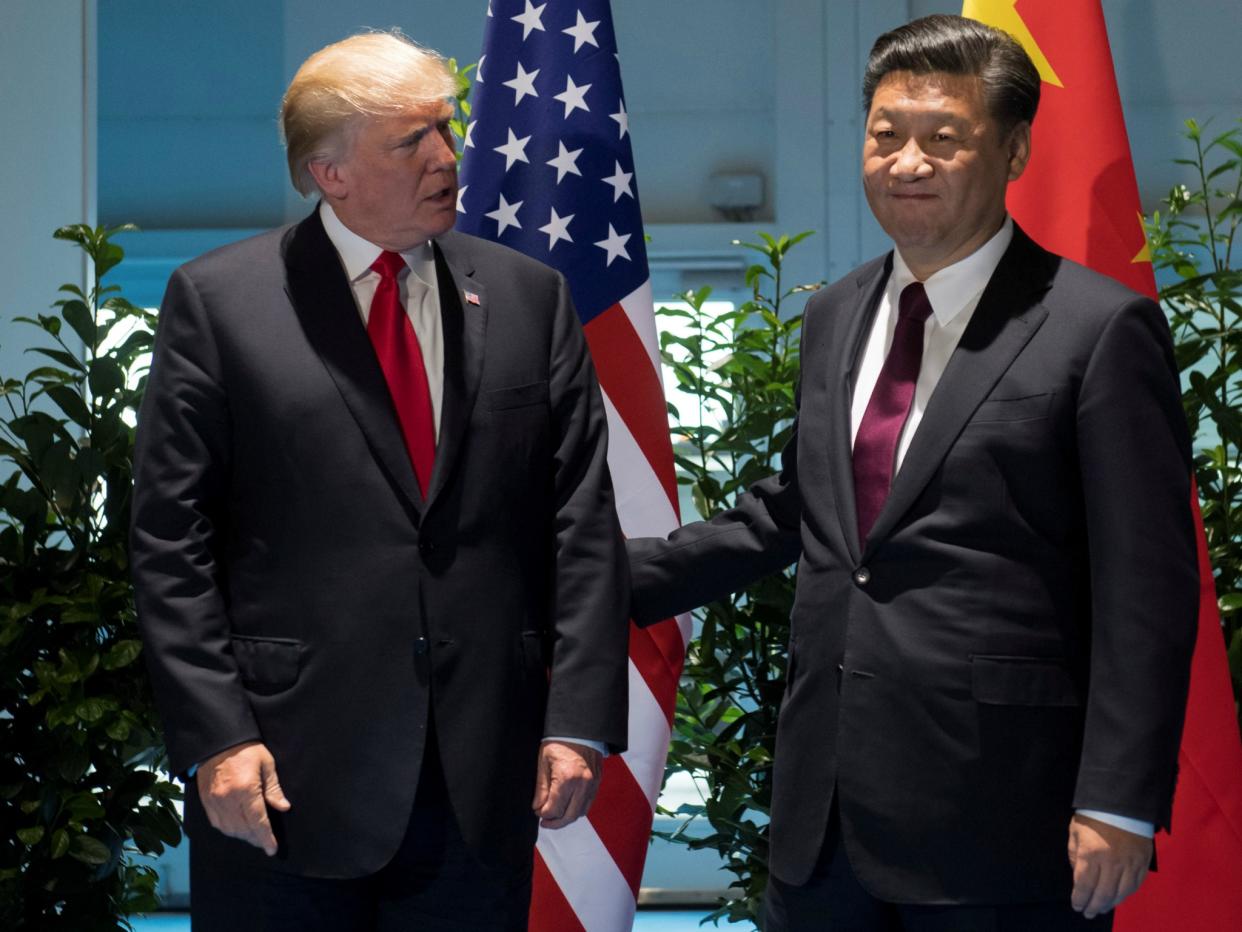 U.S. President Donald Trump and Chinese President Xi Jinping, seen here at the G20 Summit in Hamburg, Germany on July 8, 2017, discussed options for containing the North Korean threat: Reuters