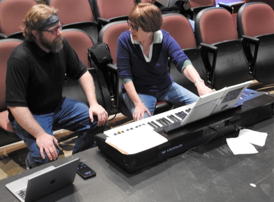 Andrew Servais with musical director Jane Crow go over vocal parts for the production of "Jesus Christ Superstar" opening for the Coshocton Footlight Players at the Triple Locks Theater.