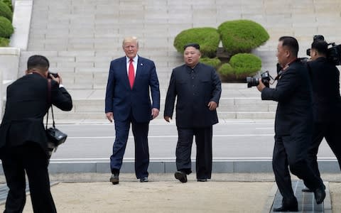 Donald Trump became the first sitting president to step into North Korea - Credit: Susan Walsh/AP