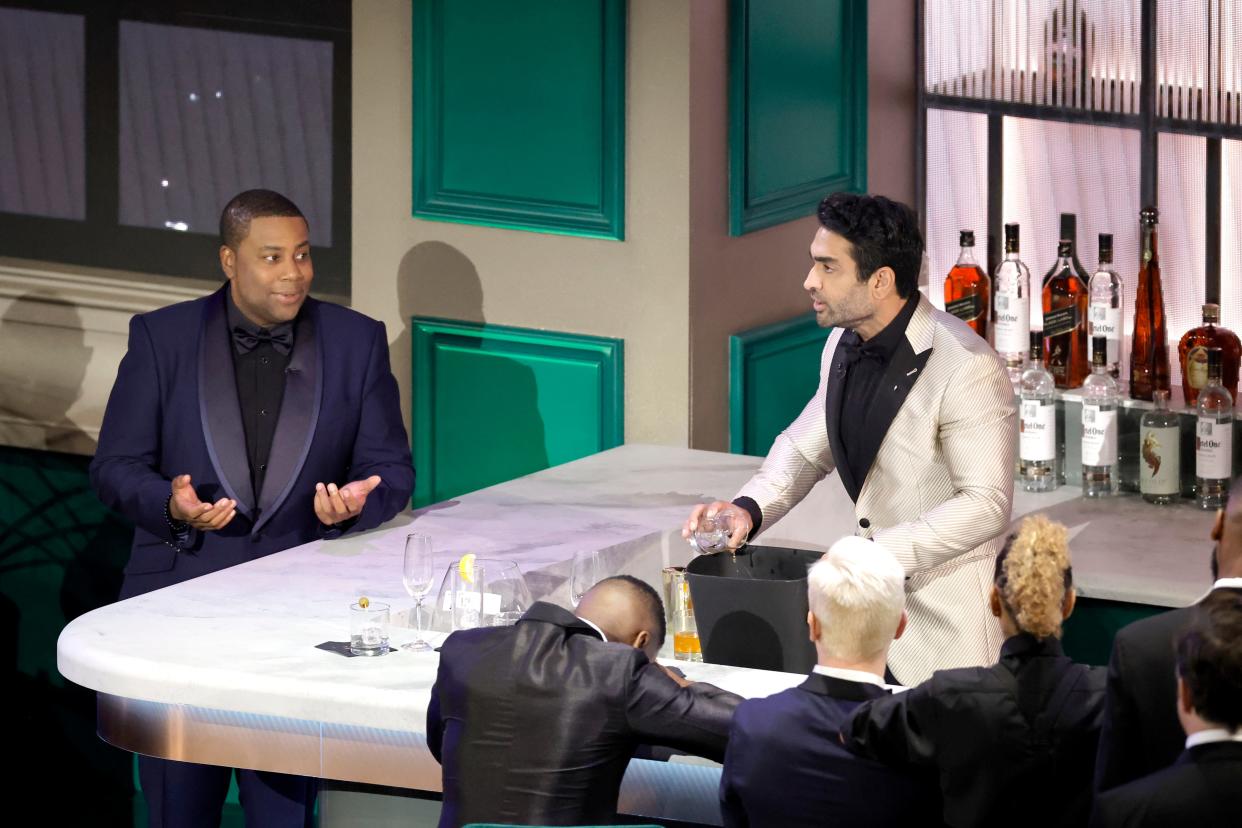Kenan Thompson and Kumail Nanjiani speak onstage during the bar scene at the Emmy Awards.