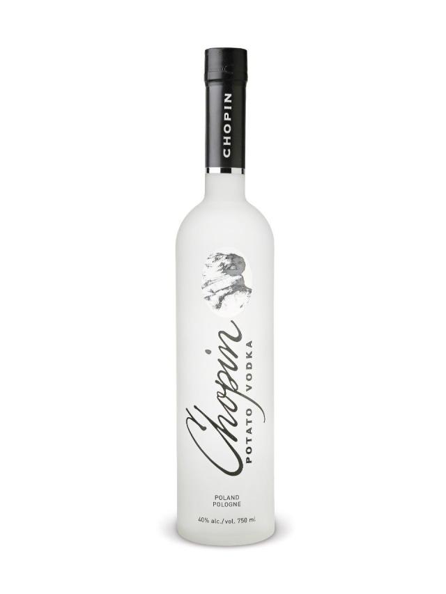 6 Litre Belvedere Vodka with light in base next to a stand…