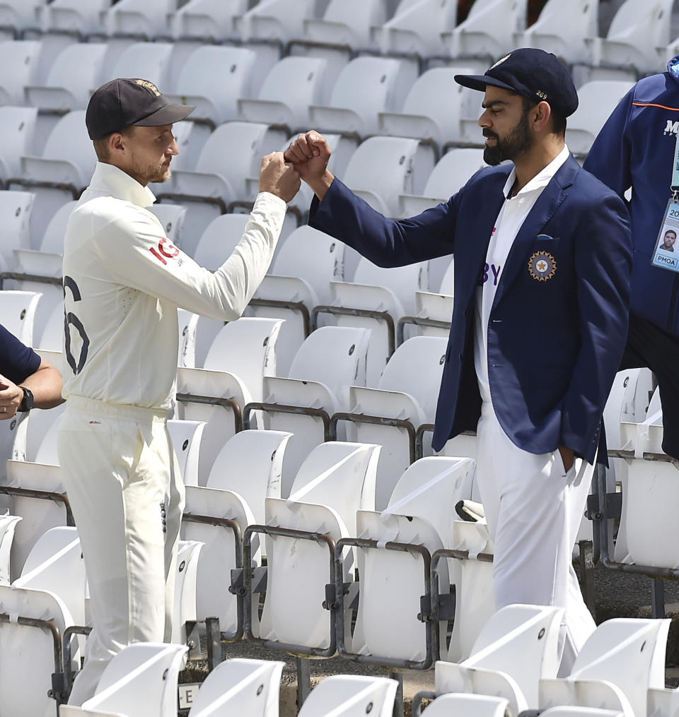 England captain Joe Root, left, and India captain Virat Kohli meet prior to the first Test Match between England and India at Trent Bridge cricket ground in Nottingham, England, Monday, Aug. 2, 2021. (AP Photo/Rui Vieira)