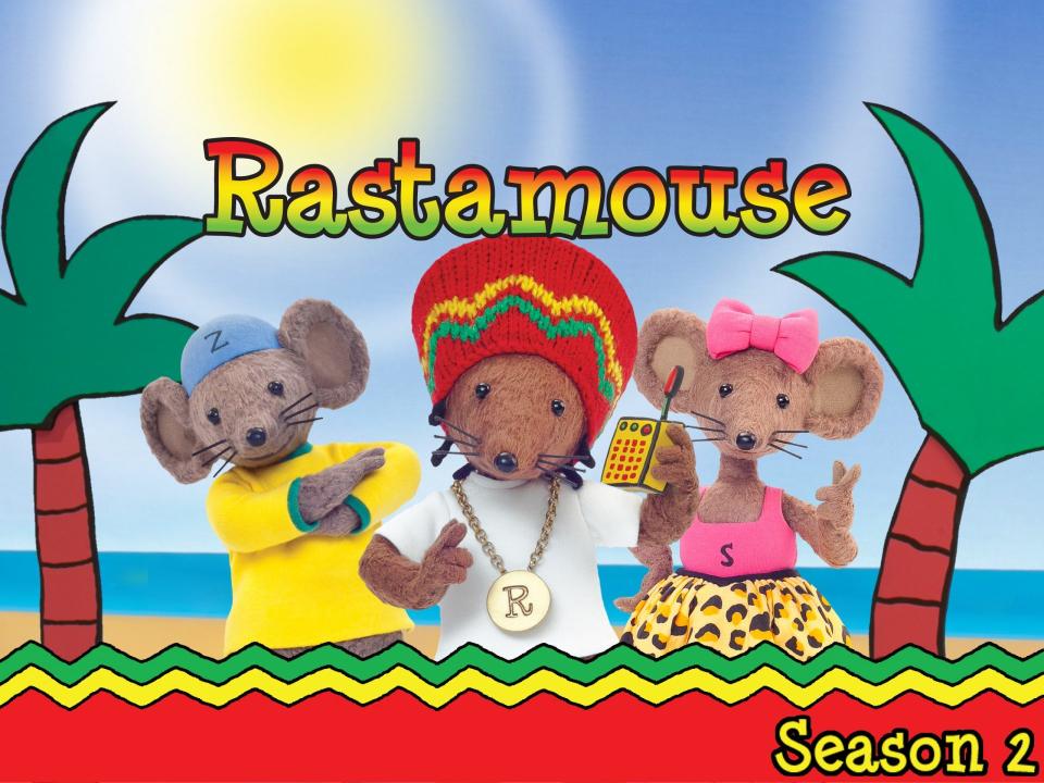 Three puppet mice stand on a cartoon beach