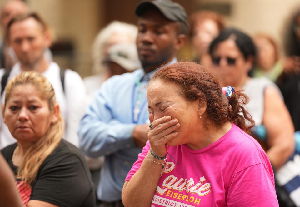 Diana Joy Stathos cries as she listens to homeless people and their supporters speak at a March 2 news conference about the planned closing of the Salvation Army's downtown homeless shelter. Stathos, who has been homeless for a year, said she had been living at the Salvation Army shelter for three weeks and didn’t know where she would go.