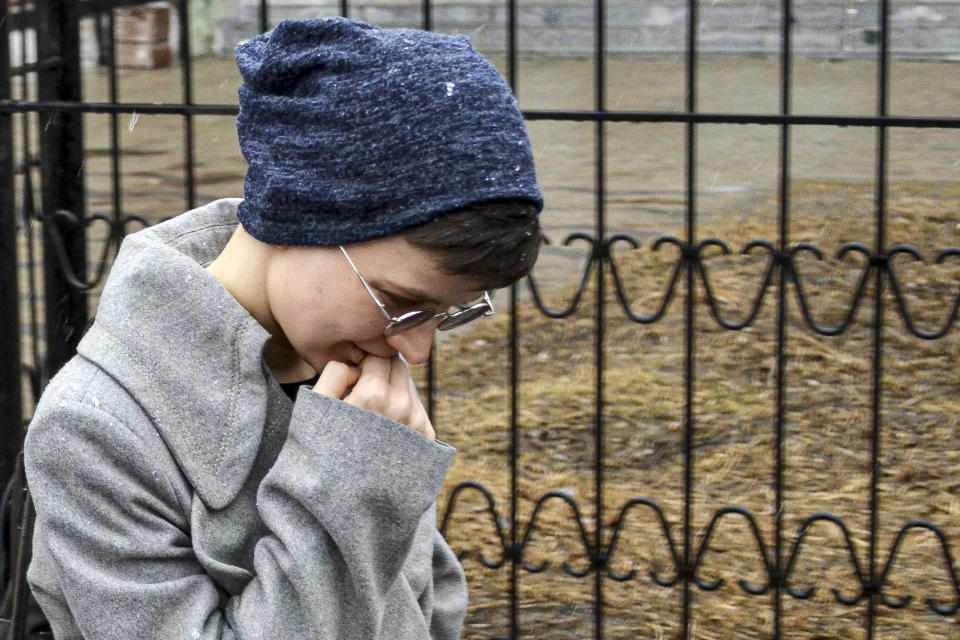 Feminist activist and artist Yulia Tsvetkova leaves after a court session in Komsomolsk-on-Amur, Russia, Monday, April 12, 2021. A Russian court on Monday opened the trial of Yulia Tsvetkova charged with disseminating pornography after she shared artwork depicting female genitalia online -- a case in line with the Kremlin’s conservative stance promoting “traditional family values.” (AP Photo/Alexander Permyakov)