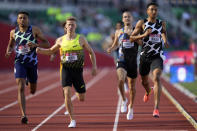 Donavan Brazier, right, wins the second heat of the men's 800-meter run at the U.S. Olympic Track and Field Trials Friday, June 18, 2021, in Eugene, Ore. (AP Photo/Ashley Landis)