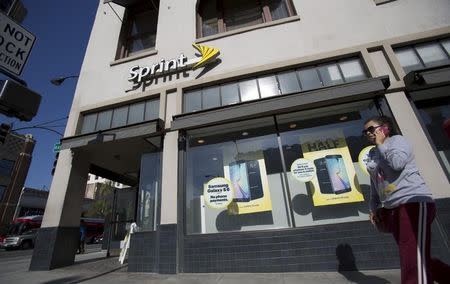 A person walks by a Sprint store in Pasadena, California May 4, 2015. REUTERS/Mario Anzuoni