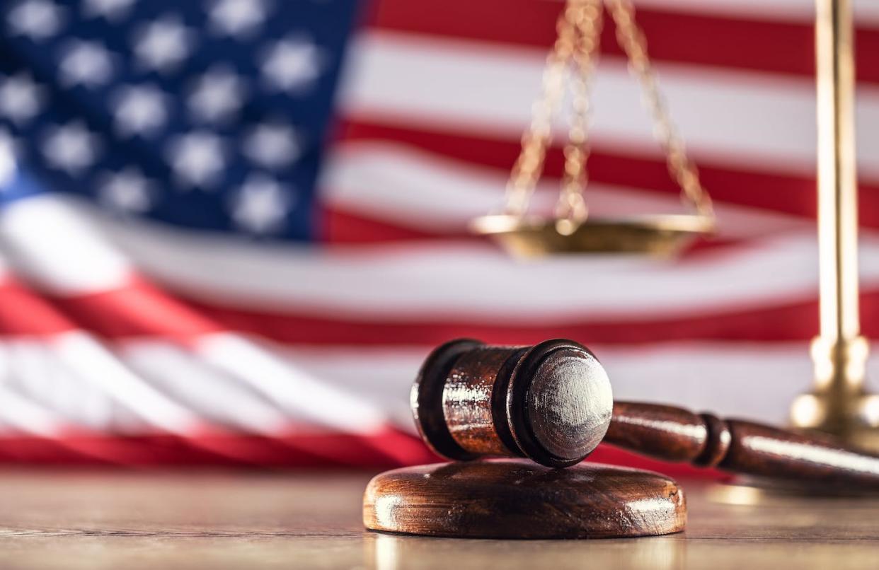 Federal courts can be high-pressure environments, even for judges. <a href="https://www.gettyimages.com/detail/photo/gavel-and-scales-with-a-us-flag-in-the-background-royalty-free-image/1486785029" rel="nofollow noopener" target="_blank" data-ylk="slk:Simple Images/Moment via Getty Images;elm:context_link;itc:0;sec:content-canvas" class="link ">Simple Images/Moment via Getty Images</a>