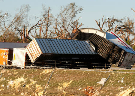 Trailers lie on their sides behind a Procter and Gamble warehouse after a tornado ripped through the area on Sunday in Albany, Georgia. REUTERS/Tami Chappell