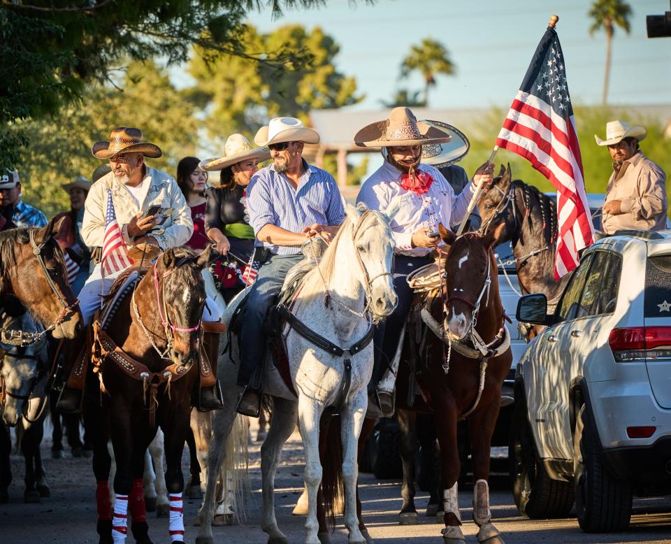 The attendees of "Cabalgata a Las Urnas," a horse procession with community partners including ACLU Arizona that will lead voters to the polls, gather on the road to Rancho Ochoa to begin moving toward the polls in Phoenix on Nov. 8, 2022.