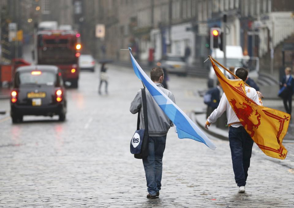 Two supporters from the "Yes" Campaign walk back home in Edinburgh, Scotland