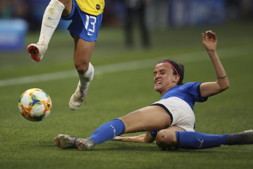 Italy's Barbara Bonansea tries to block Brazil's Leticia Santos during the Women's World Cup Group C soccer match between Italy and Brazil at the Stade du Hainaut in Valenciennes, France, Tuesday, June 18, 2019. (AP Photo/Francisco Seco)