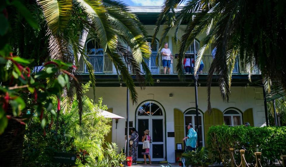 Tourists visit the the Hemingway Home and Museum in Key West, Florida, on Saturday, Dec. 11, 2021.