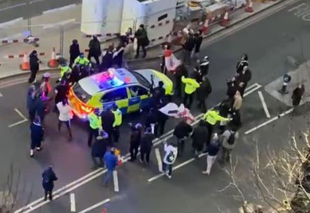 <strong>Clashes between police and protesters in Westminster as officers use a police vehicle to escort Labour leader Keir Starmer to safety.</strong> (Photo: Conor Noon via PA Media)