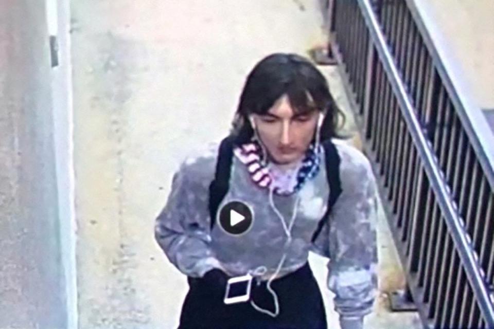 Surveillance image of what police believe to be is Robert E Crimo dressed in women’s clothing (via REUTERS)