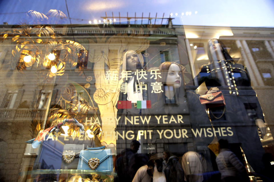 Dummies are displayed in a fashion shop at the Montenapoleone shopping district, in Milan, Italy, Tuesday, Feb. 4, 2020. China's virus outbreak is giving global business a chill. In Milan’s luxury Montenapoleone shopping district, dozens of luxury brands decked out their windows for Chinese New Year. But wealthy Chinese shoppers, who are responsible for about one-third of all luxury purchases globally, have failed to arrive in their usual numbers. (AP Photo/Luca Bruno)