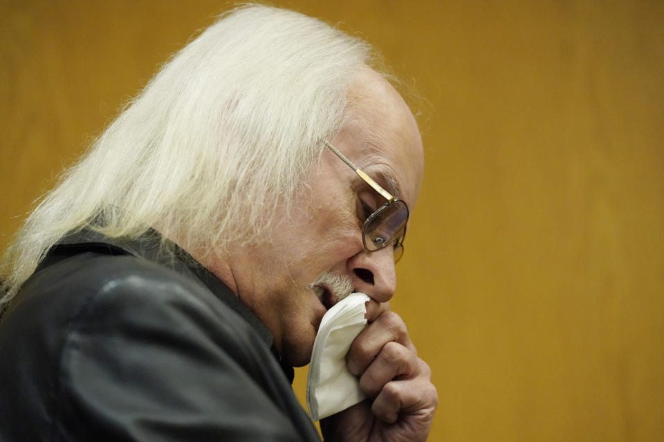 James Darrell White, father of slain Brookhaven Police Officer James White, wipes away tears as he speaks directly to his son's admitted killer Marquis Aaron Flowers, in the Lincoln County Circuit Court, moments after he plead guilty to first degree murder in the 2018 shooting deaths of two Brookhaven police officers including White, Wednesday morning, Nov. 3, 2021, in Brookhaven, Miss. Members of the officers' families addressed the court in emotional impact statements, asking for the maximum sentences to be imposed. (AP Photo/Rogelio V. Solis)