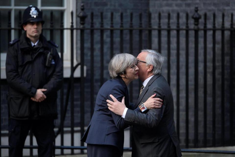 Theresa May welcomes European Commission President Jean-Claude Juncker to Downing Street for talks (REUTERS)