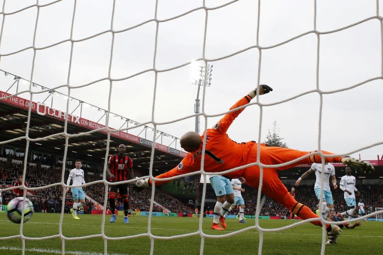 West Ham United's goalkeeper Darren Randolph dives but fails to stop Bournemouth's Joshua King (R) from scoring during their match on March 11, 2017