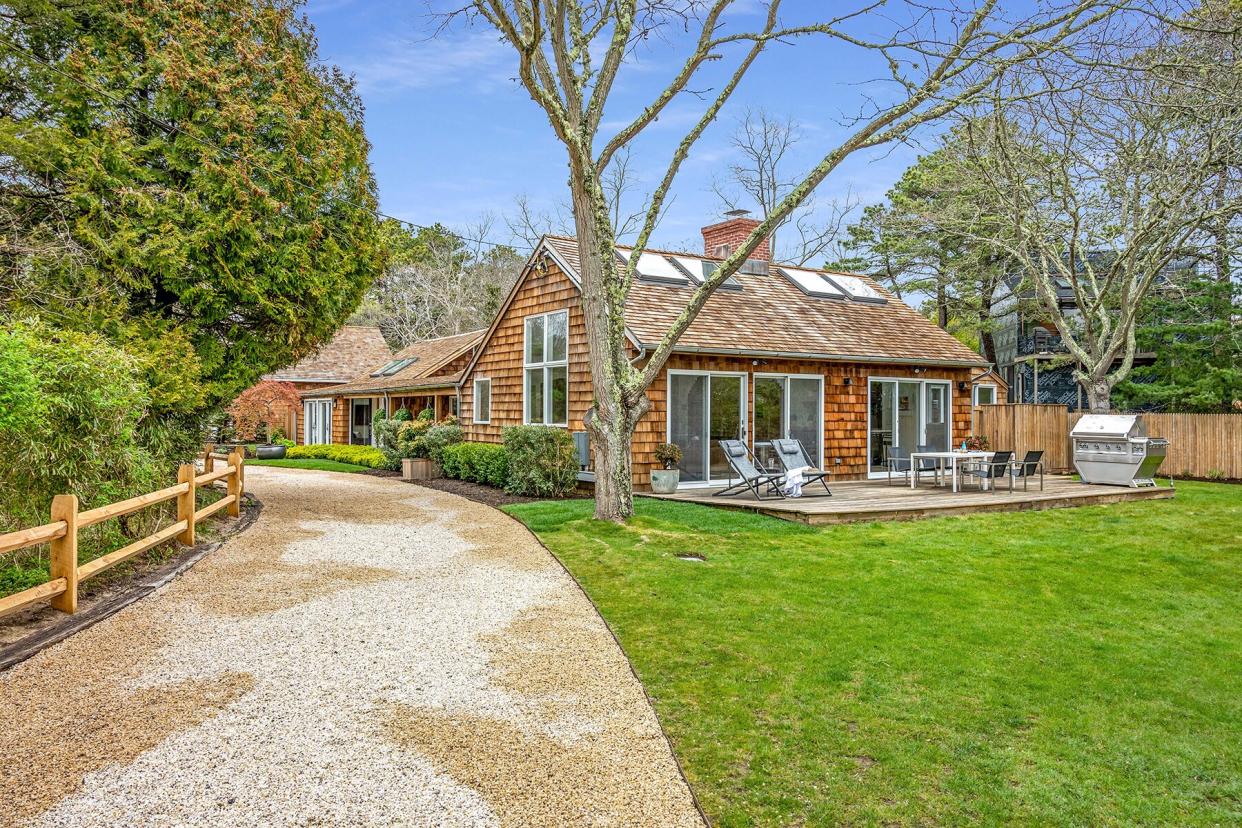 The exterior, Back Deck and Backyard of The Beach House at The Roundtree, Amagansett