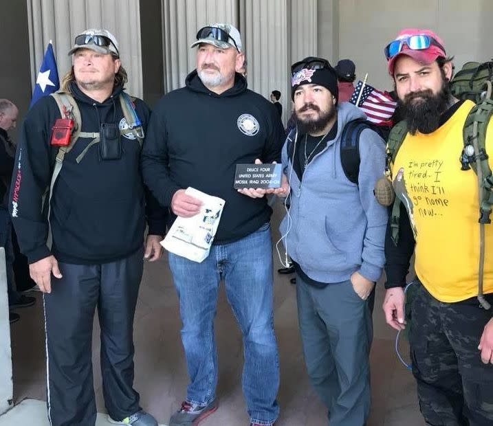 From right, Adam Lingo and Eddie Montoya pose for a photo with fellow Deuce-Four veterans at&nbsp;the end of their "Walk of Life" in Washington D.C. The veterans&nbsp;are&nbsp;holding a stone, inscribed with their infantry unit, that was set to be placed in a wall at the Department of Veteran Affairs.&nbsp; (Photo: Courtesy of Adam Lingo)