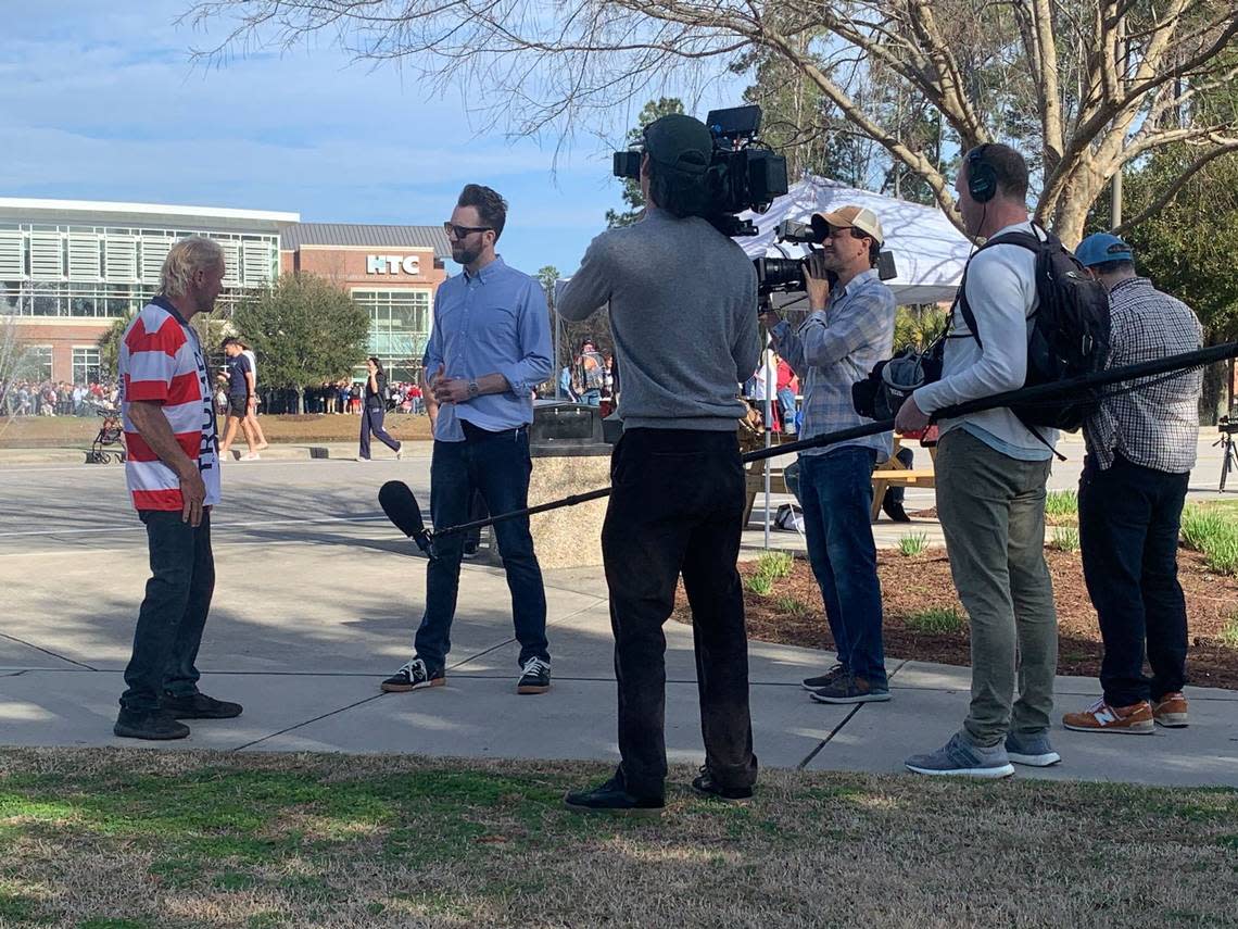 Comedian and The Daily Show correspondent is seen talking to people attending the Donald Trump presidential rally at Coastal Carolina University in Conway Saturday, Feb. 10, 2024.