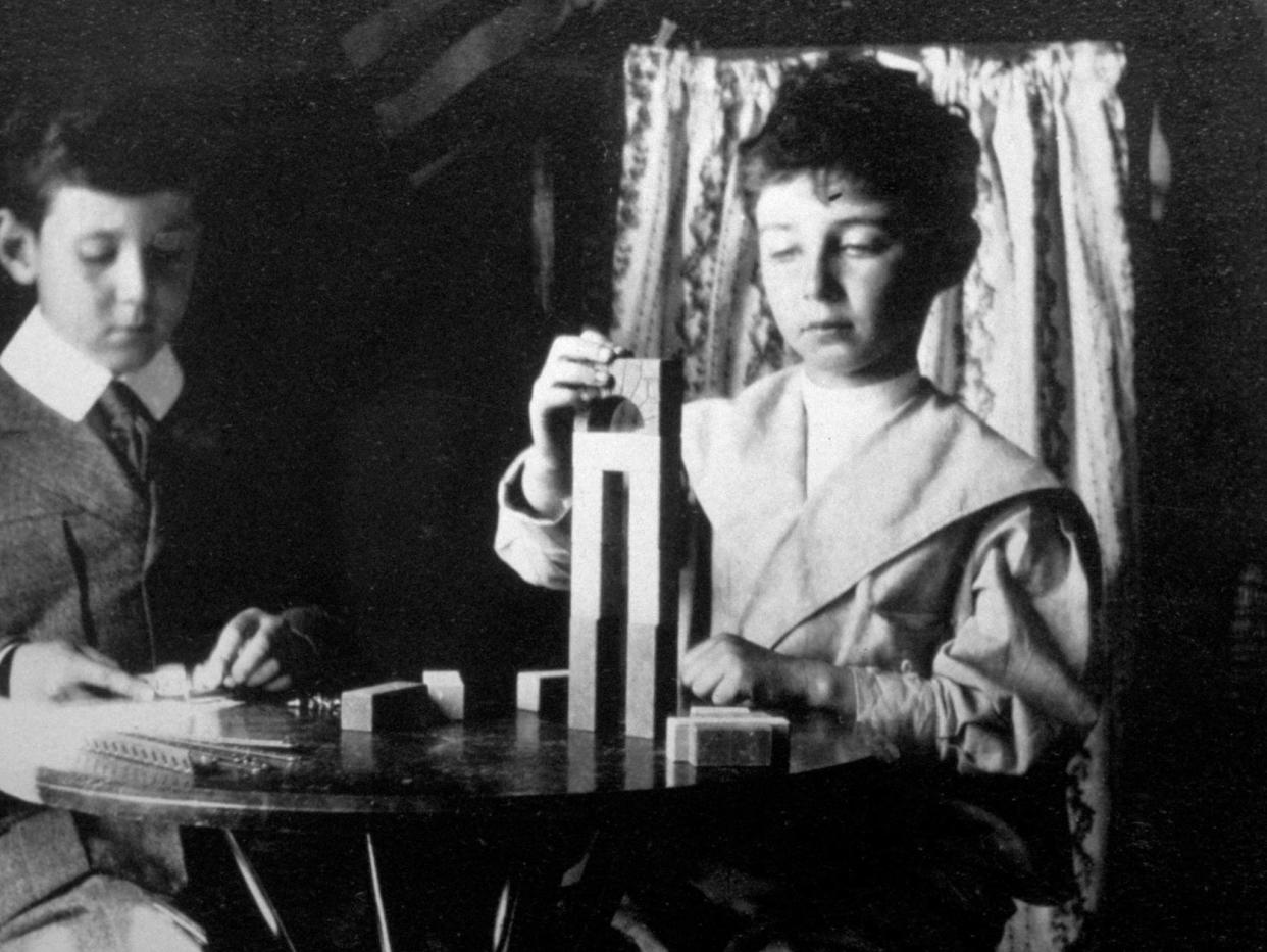 J. Robert Oppenheimer playing with blocks with his brother Frank.