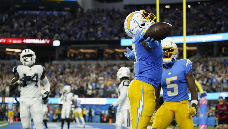 Los Angeles Chargers tight end Gerald Everett (7) celebrates in the end zone after scoring a touchdown during the second half of an NFL football game against the Dallas Cowboys on Oct. 16, 2023, in Inglewood, Calif.