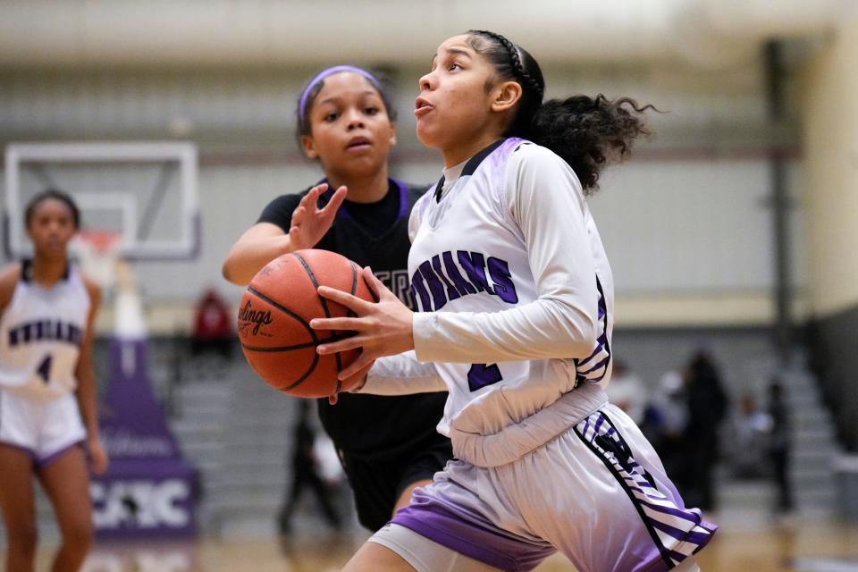 Africentric’s Rayanna Howell drives on Pickerington Central’s Rylee Bess during their game Saturday. Africentric earned the No. 2 seed in  the Division III district tournament.