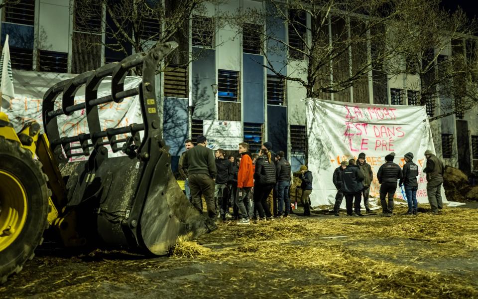 Farmers block the entrance to the French biodiversity office in Dijon