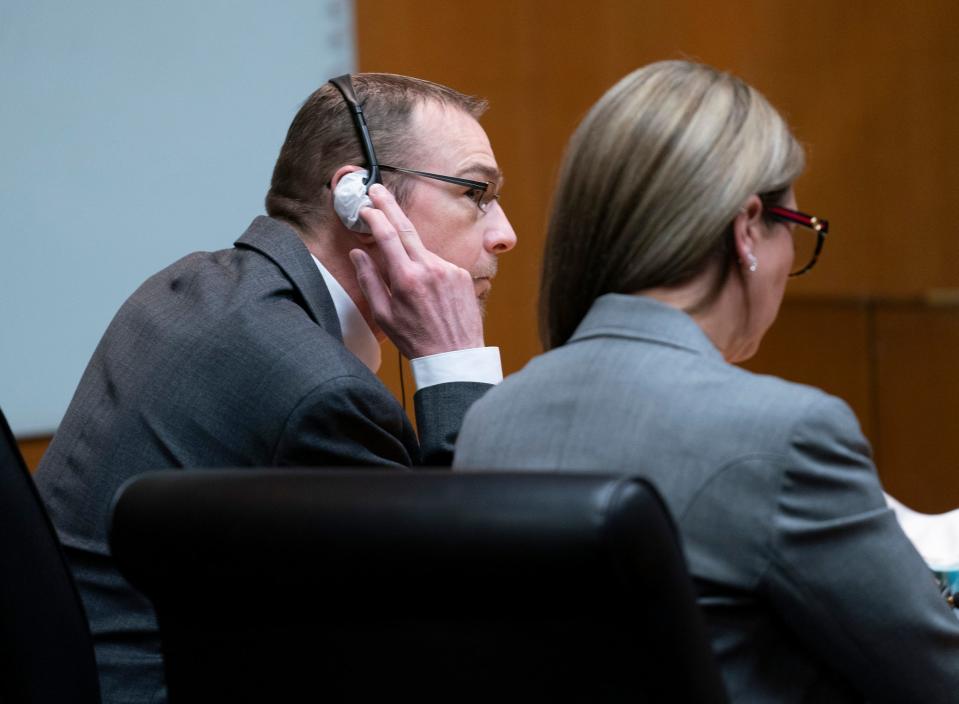 James Crumbley strains to listen as the jury reads guilty verdicts as he sits with his attorney Mariell Lehman in the Oakland County courtroom of Judge Cheryl Matthews on Thursday, March 14, 2024. Crumbley was tried on four counts of involuntary manslaughter for the four students killed in the 2021 Oxford High School shooting perpetrated by his son, Ethan Crumbley.