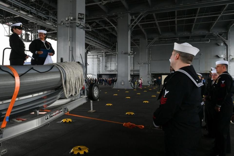 Sailors aboard the expeditionary sea base USS John L. Canley