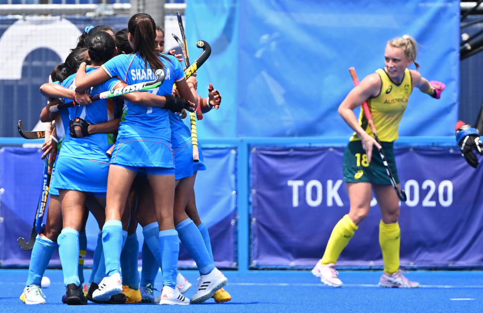 India's Gurjit Kaur (L) celebrates with teammates after scoring against Australia during their women's quarter-final match of the Tokyo 2020 Olympic Games field hockey competition, at the Oi Hockey Stadium in Tokyo, on August 2, 2021. (Photo by CHARLY TRIBALLEAU / AFP) (Photo by CHARLY TRIBALLEAU/AFP via Getty Images)