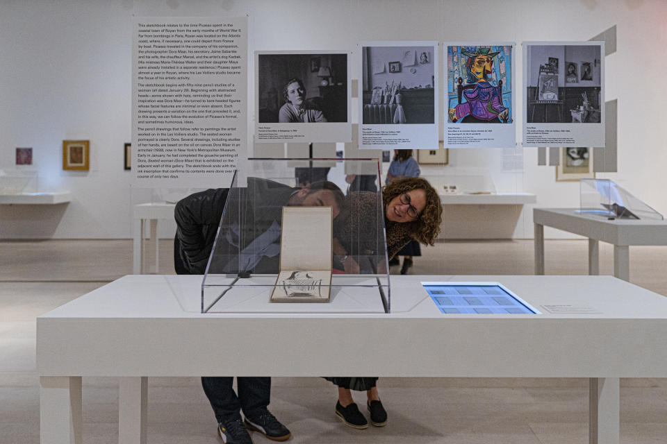 People observe part of the Picasso: 14 Sketchbooks exhibit at Pace Gallery in New York, Thursday, Nov. 9, 2023. (AP Photo/Peter K. Afriyie)