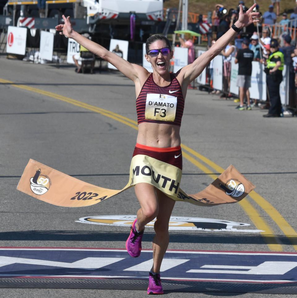 Keira D'Amato takes the tape at the finish line in 36:28 minutes at the 50th running of the Falmouth Road Race.