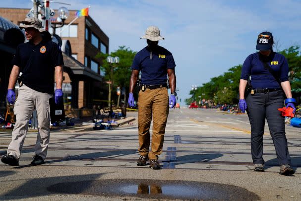 PHOTO: FBI agents investigate after a mass shooting at a Fourth of July parade in the Chicago suburb of Highland Park, Ill., July 5, 2022. (Cheney Orr/Reuters)