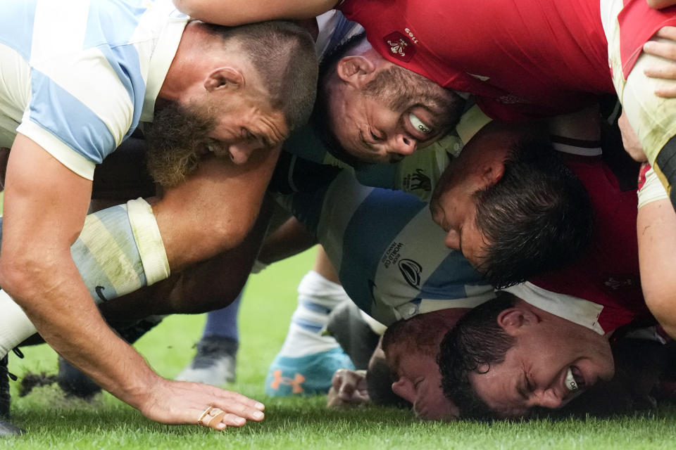 Players contest a scrum during the Rugby World Cup quarterfinal match between Wales and Argentina at the Stade de Marseille in Marseille, France, Saturday, Oct. 14, 2023. (AP Photo/Pavel Golovkin)