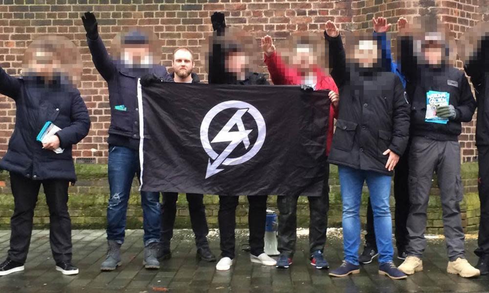  Christopher Lythgoe, who has been jailed for eight years, with the National Action flag and other supporters.