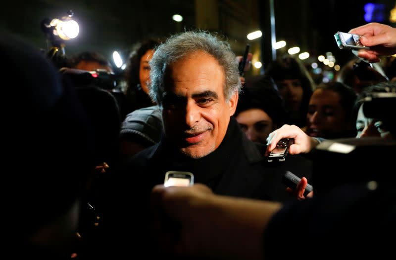 FILE PHOTO: Oman's Oil Minister Mohammed bin Hamad al-Rumhy talks to journalists as he leaves the OPEC headquarters in Vienna