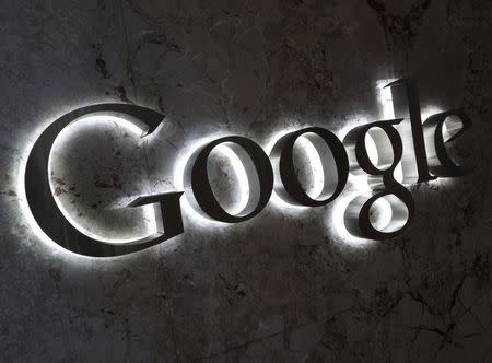 A Google logo is seen at the entrance to the company's offices in Toronto September 5, 2013. REUTERS/Chris Helgren