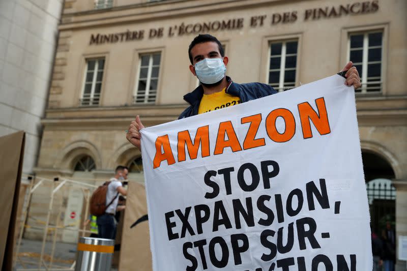 FILE PHOTO: Climate activists attend a demonstration against Amazon near the Bercy Finance Ministry in Paris