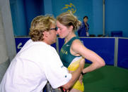28 Sep 2000: A distraught Jane Saville of Australia is consoled after being disqualified whilst near the finish of the Womens 20km Walk at the Olympic Stadium on Day Thirteen of the Sydney 2000 Olympic Games in Sydney, Australia. \ Mandatory Credit: StuForster /Allsport