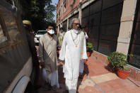 Acharya Dharmendra Dev, an accused in the 1992 attack and demolition of a 16th century mosque, leaves for a court in Lucknow, India, Wednesday, Sept. 30, 2020. An Indian court on Wednesday acquitted all 32 accused, including four senior leaders of the ruling Hindu nationalist Bharatiya Janata Party, in the case. The demolition sparked Hindu-Muslim violence that left some 2,000 people dead. (AP Photo/Rajesh Kumar Singh)