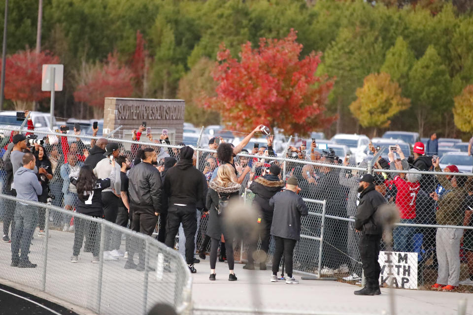 Free agent quarterback Colin Kaepernick greets fans after a workout for NFL football scouts and media, Saturday, Nov. 16, 2019, in Riverdale, Ga. (AP Photo/Todd Kirkland)