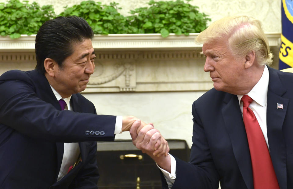 President Donald Trump shakes hands with Japanese Prime Minister Shinzo Abe in the Oval Office of the White House in Washington, Thursday, June 7, 2018. (AP Photo/Susan Walsh)