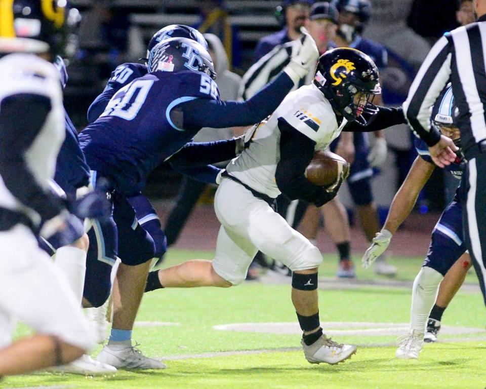 Gregori running back Michael Marsden fights for extra yards during a game between Downey and Gregori at Downey High School in Modesto, California on October 27, 2023.